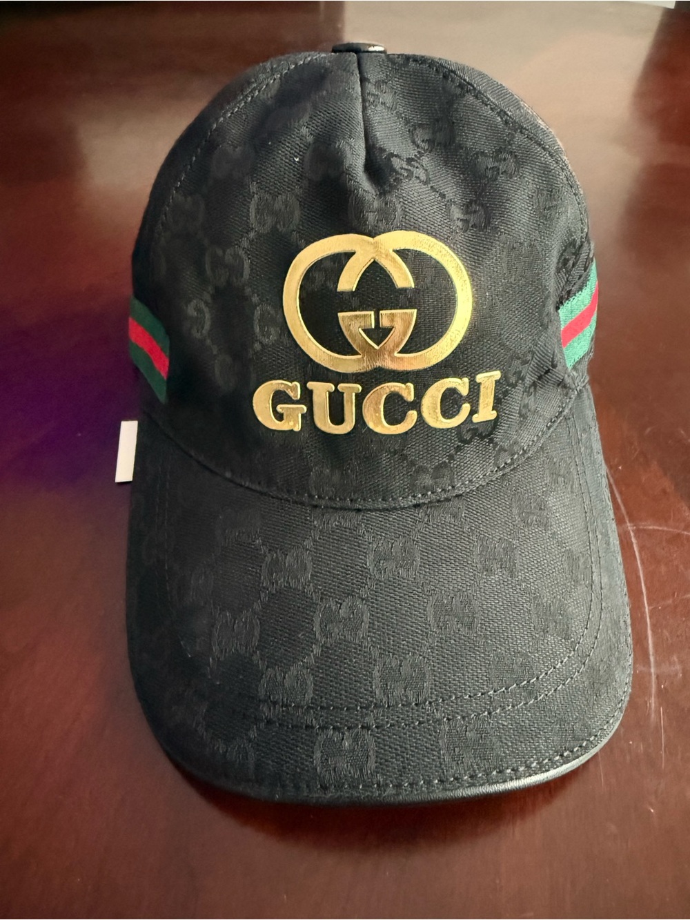 Gucci Black Cap with Gold Logo and Green-Red Web Stripes